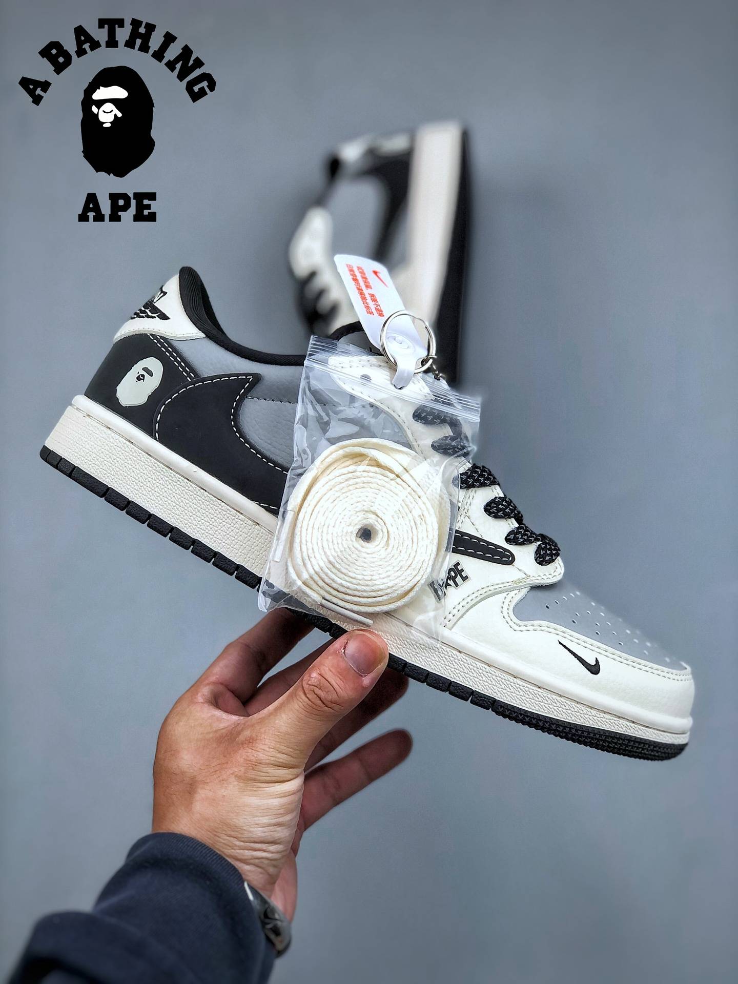 Travis Scott-Fragment Design BAPExN1KE Classic Retro Air-Jordan1 Low Low OG SP Bape-Co Branded Black, White, And Gray Stit...